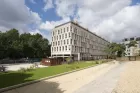 The squarish form of the Cité internationale des arts, built in white stone, amid neatly tended grounds.